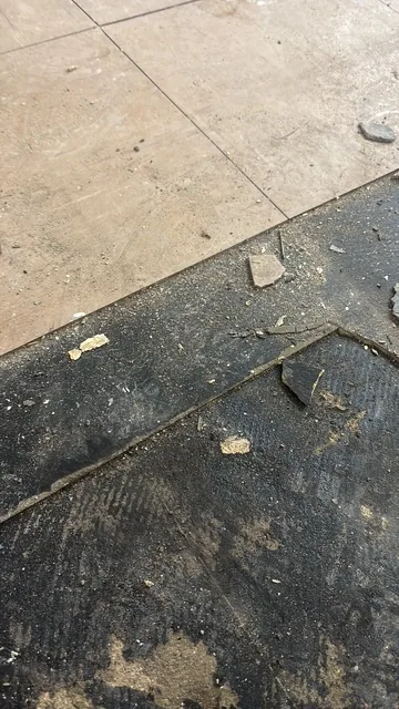 Black bitumen mastic floor removal in a NW8 flat